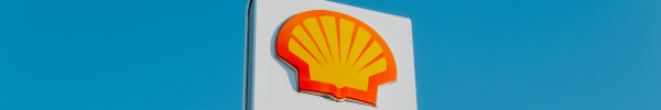 Shell logo on sign against blue sky